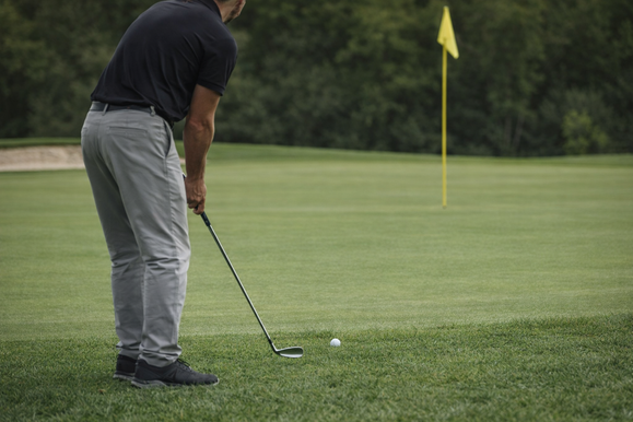 Golfer preparing a short game shot after a missed green