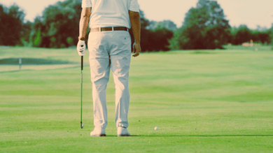 a golfer calm before he approaches his shot