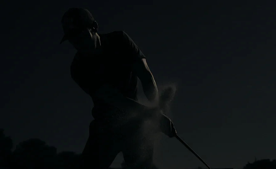 Silhouette of a golfer in action against a dark background